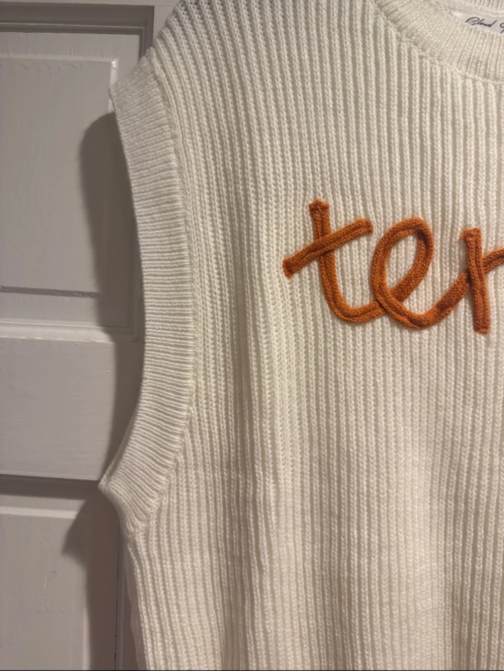 Sleeveless Crewneck Knit Sweater in Cream with Orange Script - Picture 3 of 6